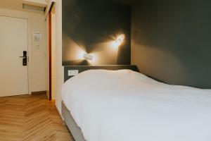 Voodi või voodid majutusasutuse Hotel Jerom toas