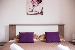 Łóżko lub łóżka w pokoju w obiekcie Apartment Ivona