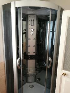 a glass elevator with buttons and controls in a room at Appartamento cuore al centro di Taranto in Taranto