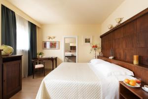 Voodi või voodid majutusasutuse Hotel Corsignano toas