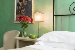 Voodi või voodid majutusasutuse Hotel Corsignano toas