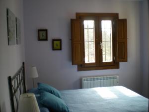Posteľ alebo postele v izbe v ubytovaní Apartamentos San Martin