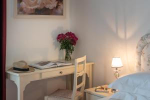 Voodi või voodid majutusasutuse Hotel Corsignano toas