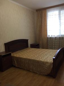 Кровать или кровати в номере Apartment Rakhmaninova