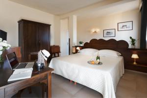 Voodi või voodid majutusasutuse Hotel Corsignano toas