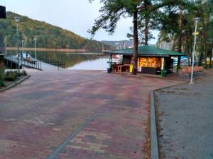 a building next to a body of water at Apartmán v Zátiší in Staré Splavy +5 photos