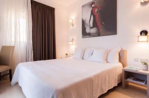Letto o letti in una camera di Alexandra Hotel