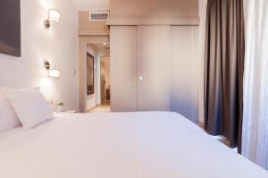 Letto o letti in una camera di Alexandra Hotel