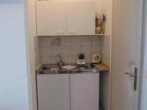 Kuchyň nebo kuchyňský kout v ubytování Apartments Marija