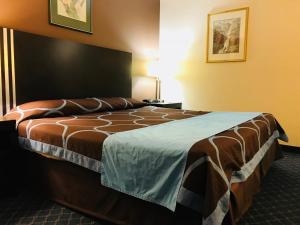 Postel nebo postele na pokoji v ubytování BA Hotel