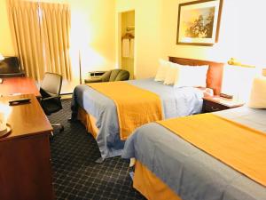 Postel nebo postele na pokoji v ubytování BA Hotel