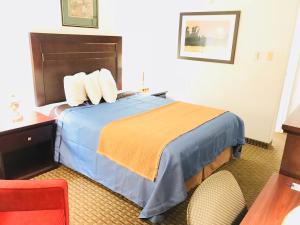Postel nebo postele na pokoji v ubytování BA Hotel