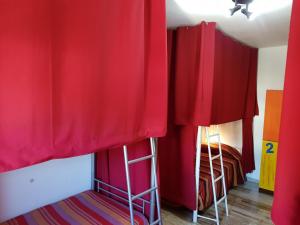 a red and white striped room with a red and white striped bed at Horta Grande in Silves