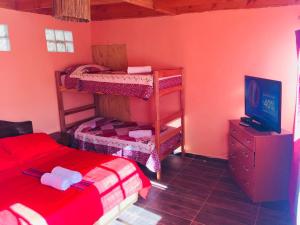 Ένα ή περισσότερα κρεβάτια σε δωμάτιο στο Hostal Intipara