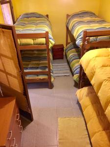 Ένα ή περισσότερα κρεβάτια σε δωμάτιο στο Hostal Intipara