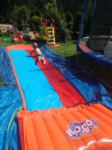 a child is playing in an inflatable play park at Willa Na Górce in Szczyrk