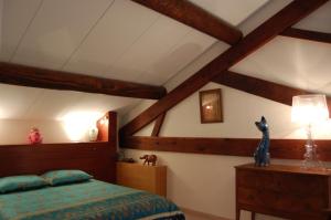 Giường trong phòng chung tại Le Mas Ferrand