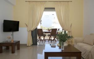 A television and/or entertainment centre at Athina Apartment