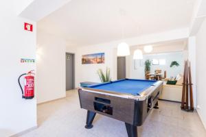 a living room with a pool table in it at Safari Beach guest house in Lagos