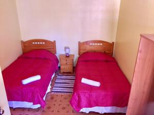 Ένα ή περισσότερα κρεβάτια σε δωμάτιο στο Hostal Intipara