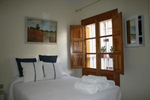 A bed or beds in a room at Atico Amistad