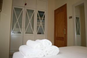 A bed or beds in a room at Atico Amistad