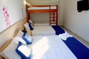 Letto o letti in una camera di Mandala Hotel