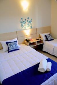 Letto o letti in una camera di Mandala Hotel