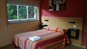 Posteľ alebo postele v izbe v ubytovaní Hostal-Meson Vilasante