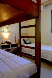 Postel nebo postele na pokoji v ubytování Mandala Hotel