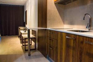Kuchyň nebo kuchyňský kout v ubytování Palm Aparthotel
