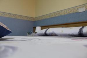 Postel nebo postele na pokoji v ubytování Hotel Diana