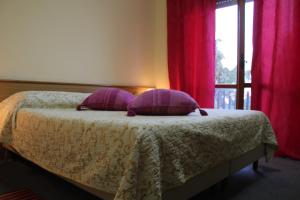 Postel nebo postele na pokoji v ubytování Hotel Diana