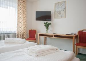Postel nebo postele na pokoji v ubytování Hotel Hessenhof