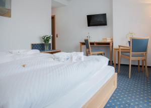 Postel nebo postele na pokoji v ubytování Hotel Hessenhof
