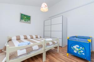 Postel nebo postele na pokoji v ubytování Apartmani Bego