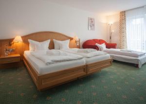 Postel nebo postele na pokoji v ubytování Hotel Hessenhof