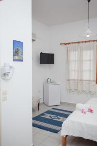 Postel nebo postele na pokoji v ubytování Anestoula Rooms