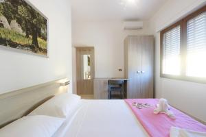 Postel nebo postele na pokoji v ubytování B&B Adriana
