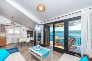 a living room with a view of the ocean at Bace Apartments in Klek