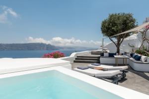 a pool with a view of the ocean on a villa at Chelidonia Luxury Suites in Oia