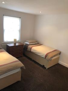 A bed or beds in a room at 1 Laurel Court