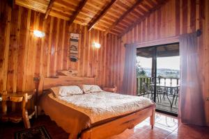 Postel nebo postele na pokoji v ubytování Apart hotel Puchaley Lafquen + 37 fotografií