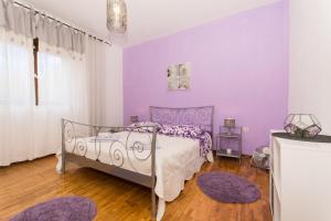 Postel nebo postele na pokoji v ubytování Apartment Lorenzo