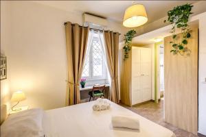 Posteľ alebo postele v izbe v ubytovaní Cuore di Florio Apartment