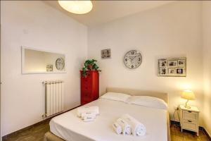 Posteľ alebo postele v izbe v ubytovaní Cuore di Florio Apartment