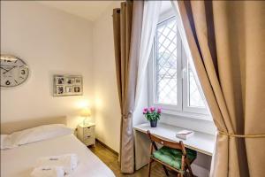 Posteľ alebo postele v izbe v ubytovaní Cuore di Florio Apartment