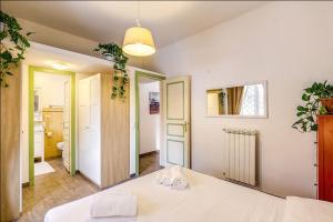 Posteľ alebo postele v izbe v ubytovaní Cuore di Florio Apartment