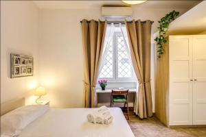 Posteľ alebo postele v izbe v ubytovaní Cuore di Florio Apartment
