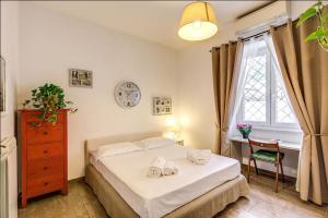 Posteľ alebo postele v izbe v ubytovaní Cuore di Florio Apartment